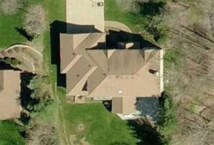 an aerial image of a home roofing