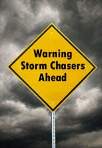 warning sign for storm chaser roofing company